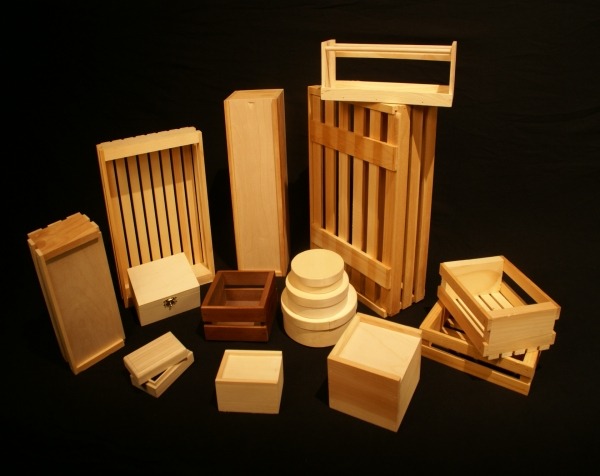 A variety of custom wooden boxes and crates, including slatted wooden boxes, hinged-top boxes, and slide-top boxes, available in bulk for packaging and storage.